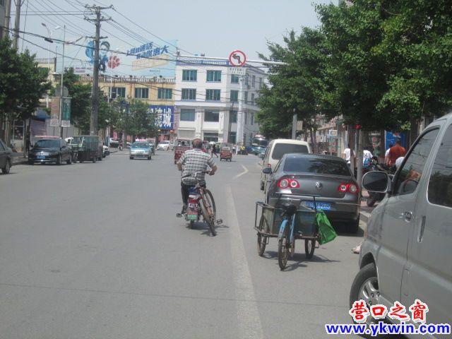 熊岳：一人骑两车